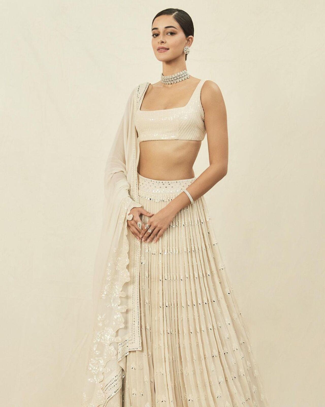 Ananya Panday looked elegant in a Sawan Gandhi white lehenga. The skirt came with mirror work whereas the blouse had sequins